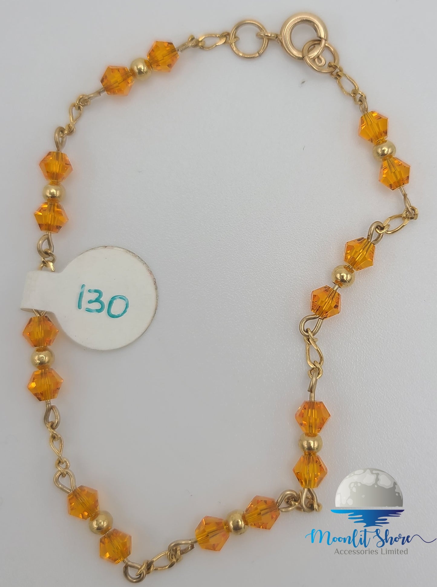 HANDBAND WITH ORANGE AND GOLD BEADS